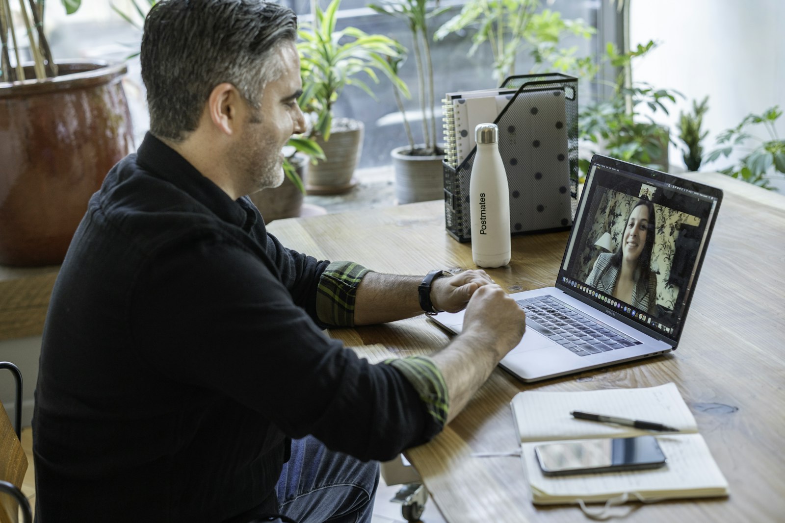 creative professionals working together in modern studio maintaining brand consistency